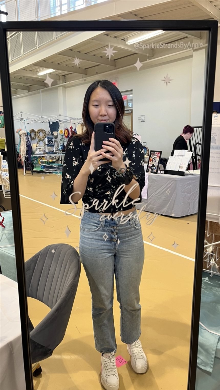 Annie Deng, founder of Sparkle Strands, at a hair tinsel pop-up event